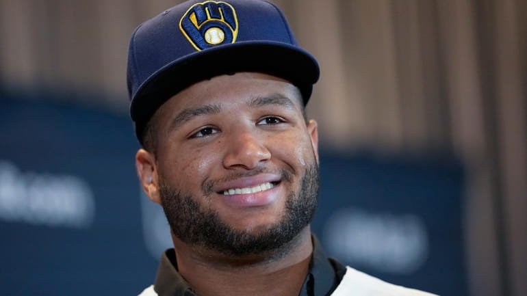 Milwaukee Brewers outfielder Jackson Chourio responds to questions following a...
