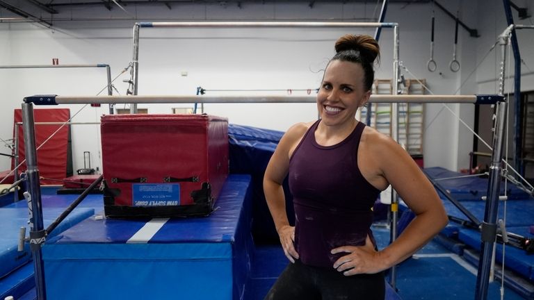 Angela Fuller, 44, poses as she trains at 5280 Gymnastics,...