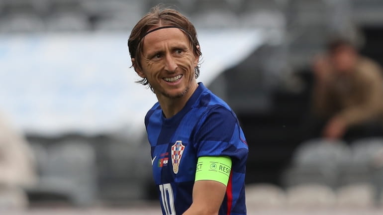 Croatia's Luka Modric celebrates after scoring his side's first goal...