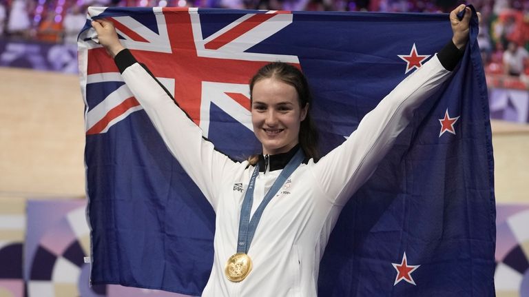 Ellesse Andrews of New Zealand poses with the gold medal...