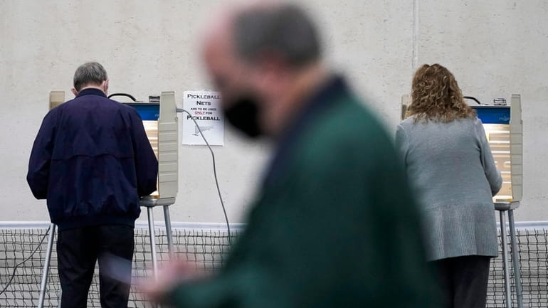 People vote at the Milwaukee County Sports Complex, on Nov....