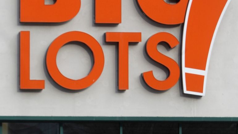 A shopper leaves the Big Lots store on Dec. 4,...