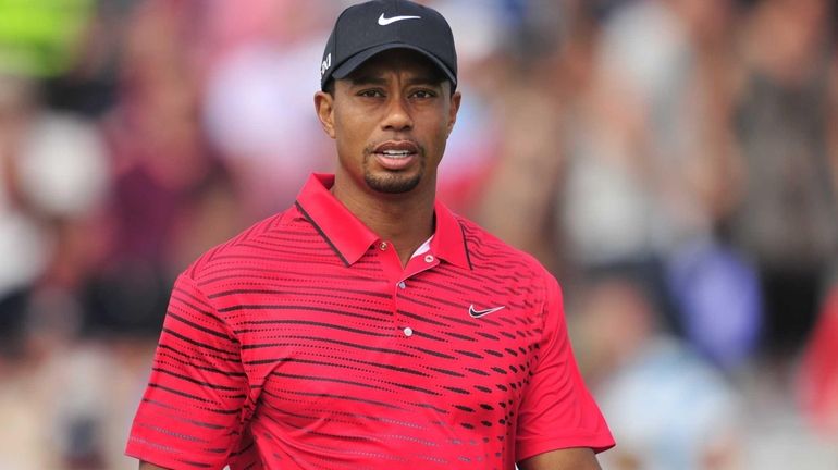 Tiger Woods looks on during his final round on day...