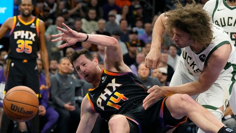 Phoenix Suns forward Drew Eubanks (14) is hit by Milwaukee...