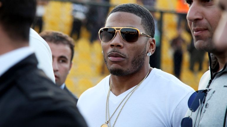 Rapper Nelly approaches the stage for a concert in Erbil,...