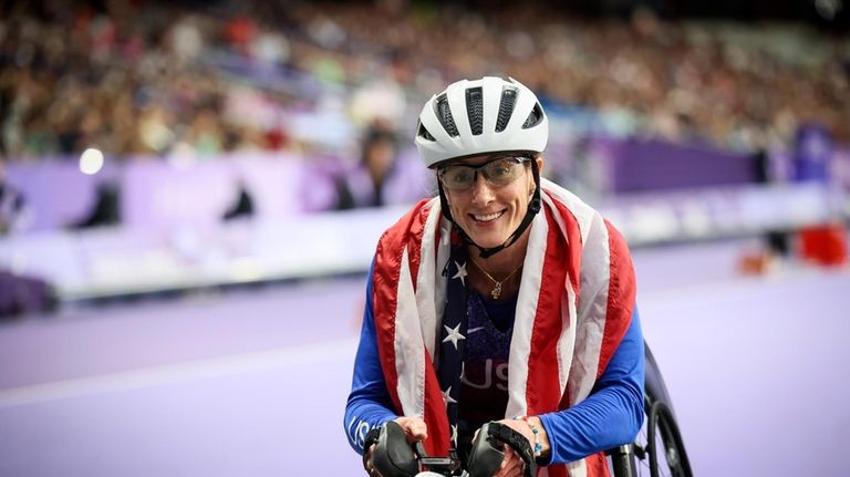 Tatyana McFadden of the U.S., celebrates before being informed she...