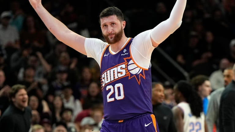 Phoenix Suns center Jusuf Nurkic acknowledges the crowd after breaking...