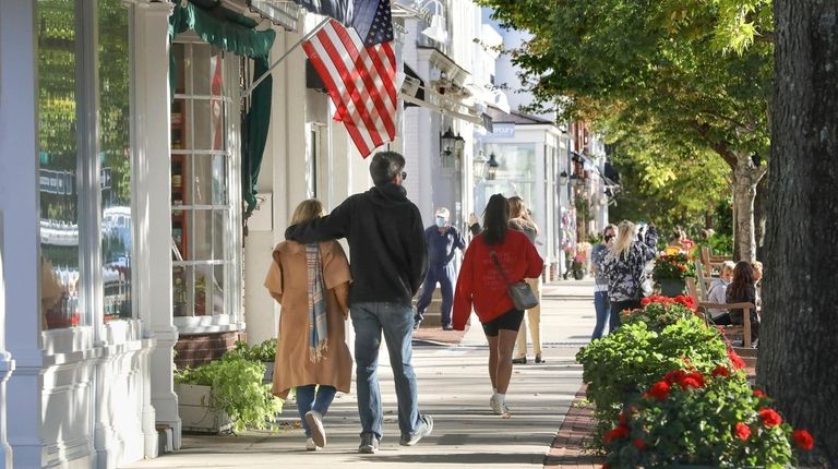 Pedestrians walk along Main Street in Southampton.