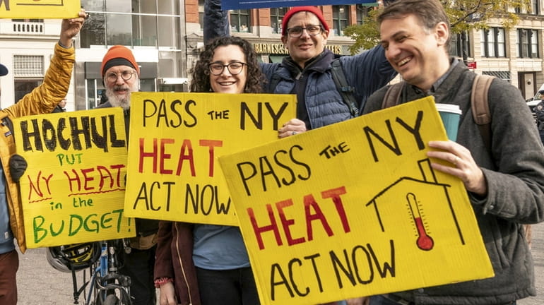 Activists pushing for the New York State HEAT Act attend...