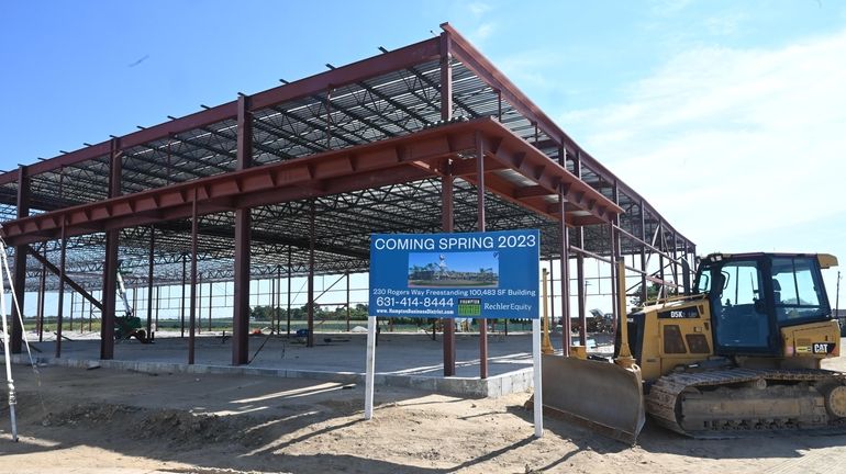 The final building under construction for a warehouse development at an industrial...