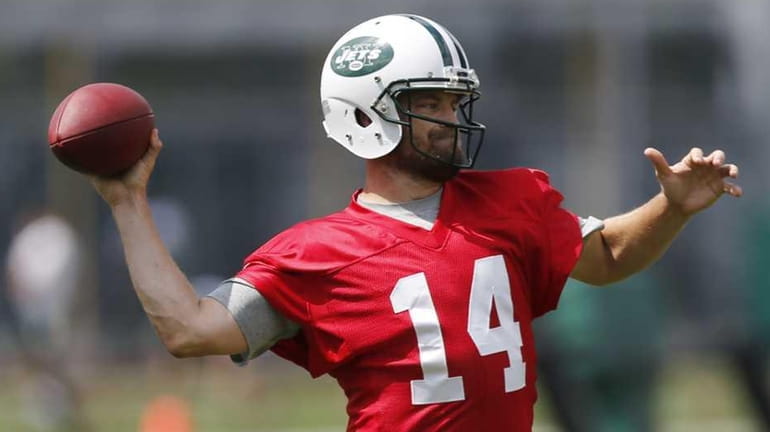 New York Jets quarterback Ryan Fitzpatrick, right, throws as offensive...