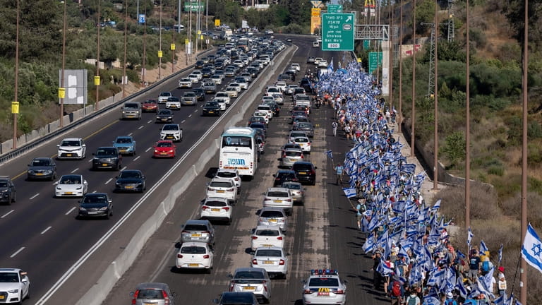 Israelis march along Highway 1 on their way to Jerusalem...