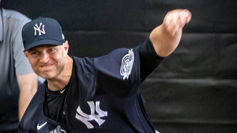 Yankees' pitcher J.A. Happ throwing in the bullpen during spring training...