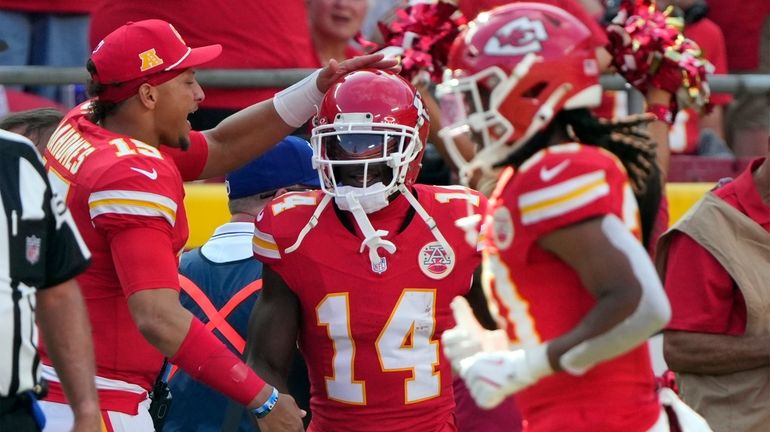 Kansas City Chiefs wide receiver Cornell Powell (14) is congratulated...