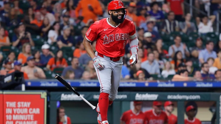 Los Angeles Angels' Jo Adell rounds the bases after his...