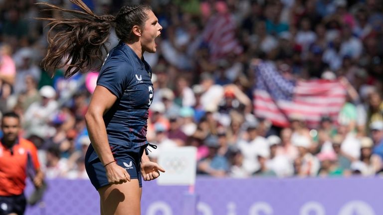 United States' Ilona Maher celebrates after scoring a try during...