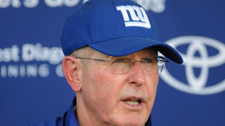 Tom Coughlin speaks to the media during training camp. (July...