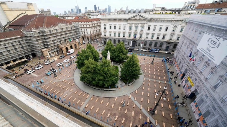 La Scala theatre square is filled with 172 coffins, as...