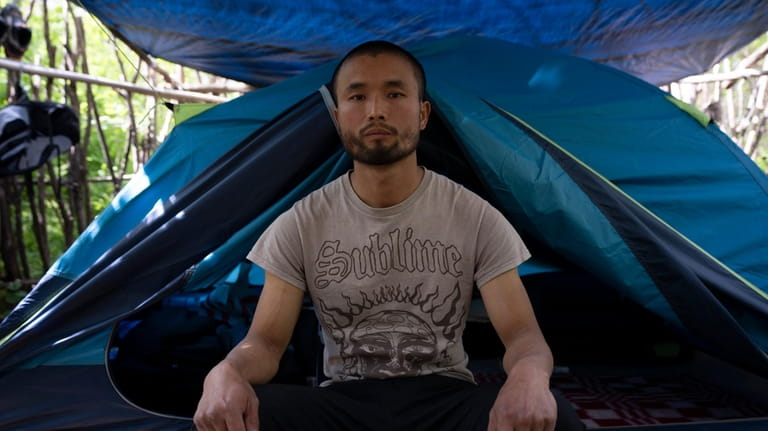 Chen Wang, a Chinese migrant currently homeless in New York,...