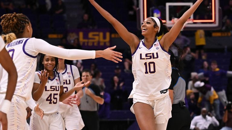 LSU forward Angel Reese (10) celebrates after making a 3-point...