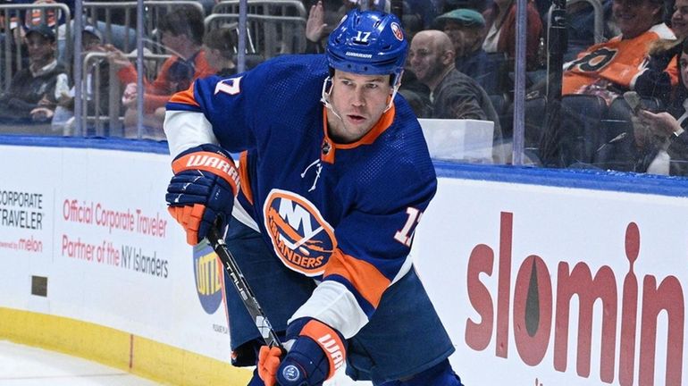 Islanders left wing Matt Martin controls the puck against the...