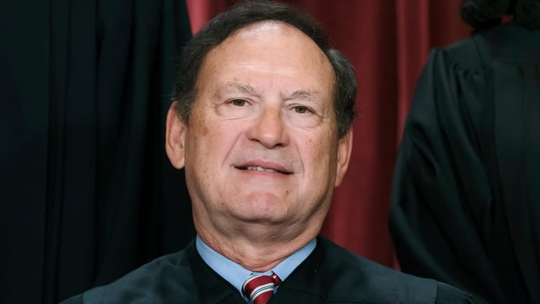 Associate Justice Samuel Alito joins other members of the Supreme...