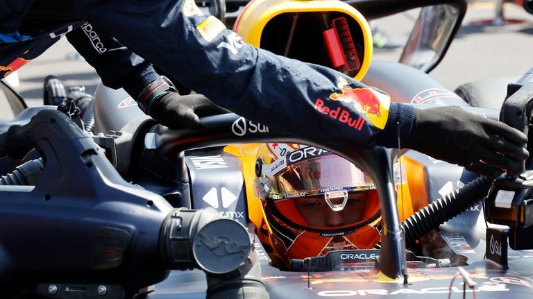 Crew prepare the car of Red Bull driver Max Verstappen...