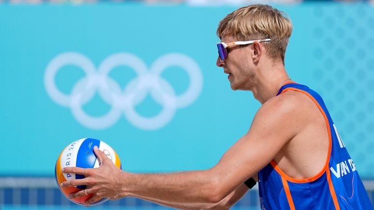 The Netherland's Steven van de Velde prepares to serve in...