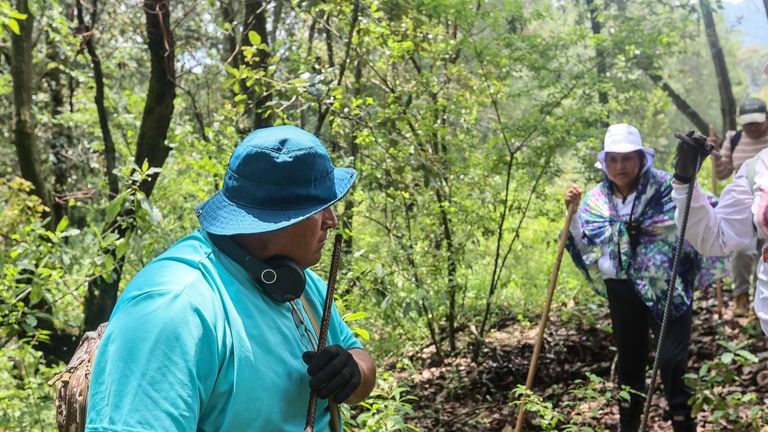 Members of the search collective "Uniendo Esperanzas" or Uniting Hope,...