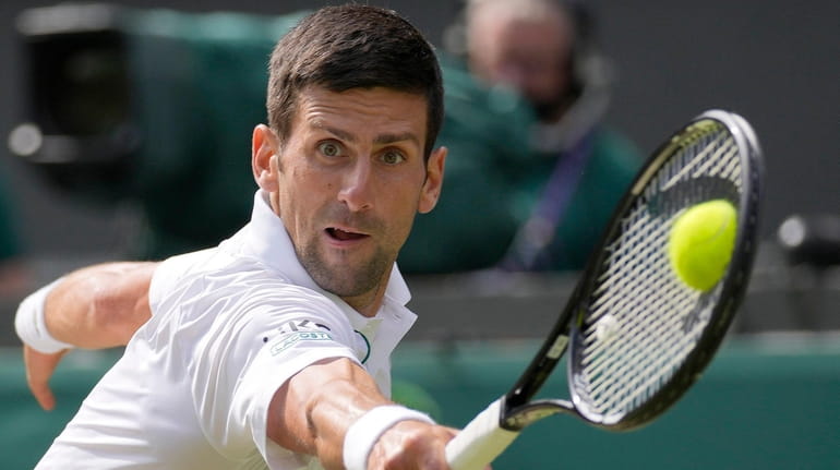 Novak Djokovic plays a return to Matteo Berrettini during the...