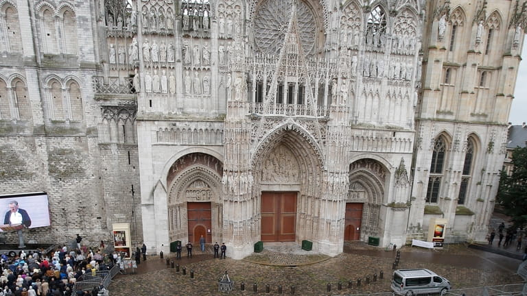 The crowd gather outside the Rouen cathedral, Normandy, during the...