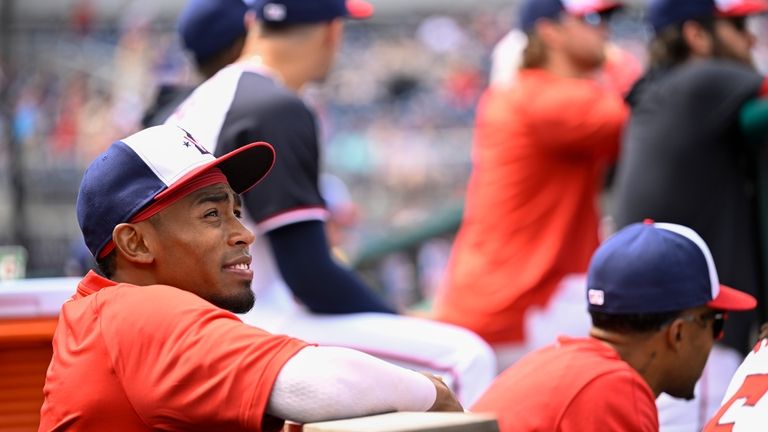 Washington Nationals' Darren Baker watches the action from the dugout...