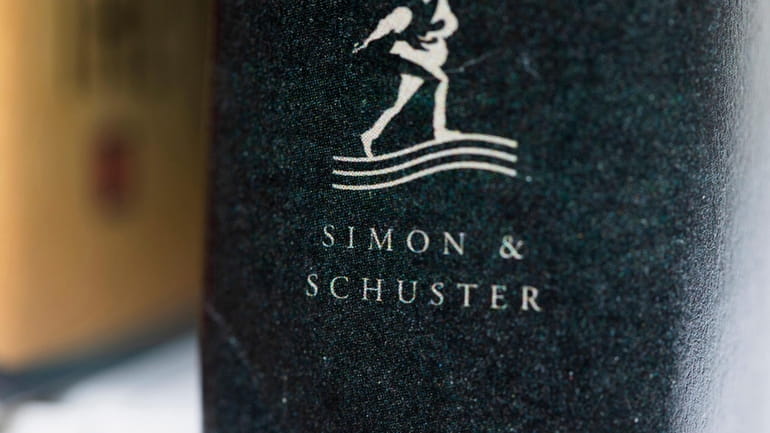 A book published by Simon & Schuster is displayed on...