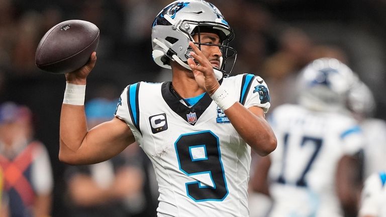 Carolina Panthers quarterback Bryce Young (9) looks to throw a...