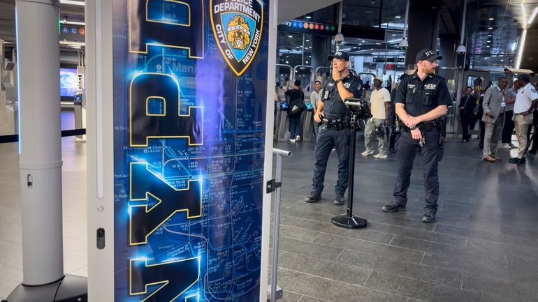 Gun detection machines are tested at the Fulton Street transit...