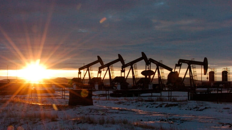 Oil pump jacks in McKenzie County in western N. D.,...
