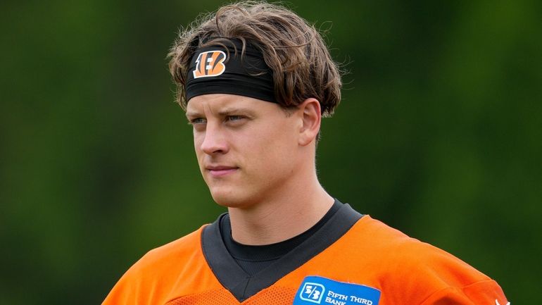 Cincinnati Bengals quarterback Joe Burrow walks onto the field during...