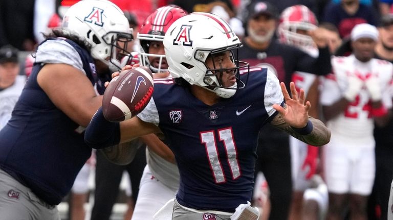 Arizona quarterback Noah Fifita throws the football against Utah during...