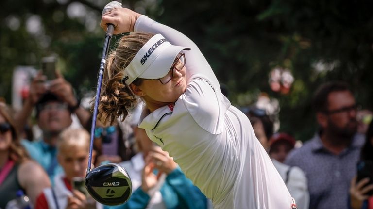 Canada's Brooke Henderson hits a tee shot on the second...