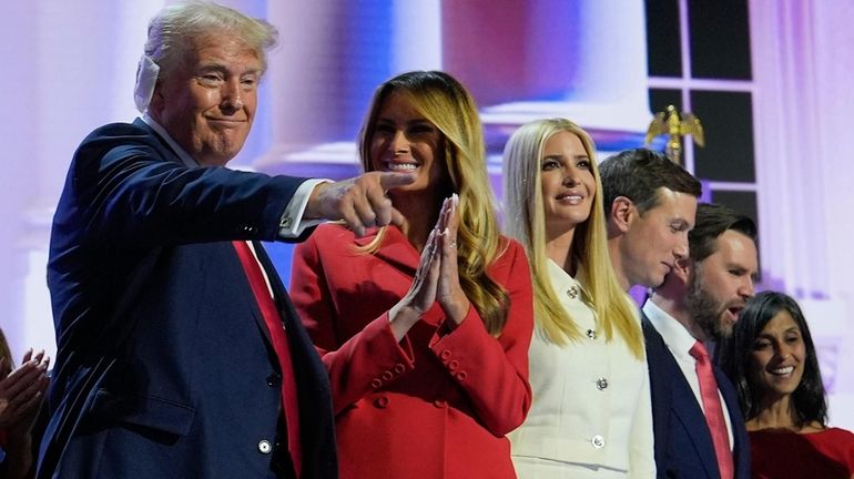 Former President Donald Trump, left, stands with Melania Trump, Ivanka Trump,...