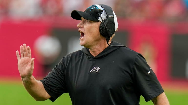 Carolina Panthers interim head coach Chris Tabor yells during the...