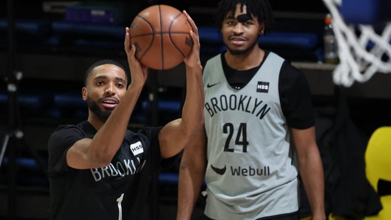 Brooklyn Nets players Mikal Bridges (L) and Cam Thomas.