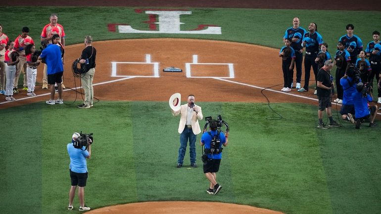 Cody Johnson performs the national anthem before the MLB All-Star...