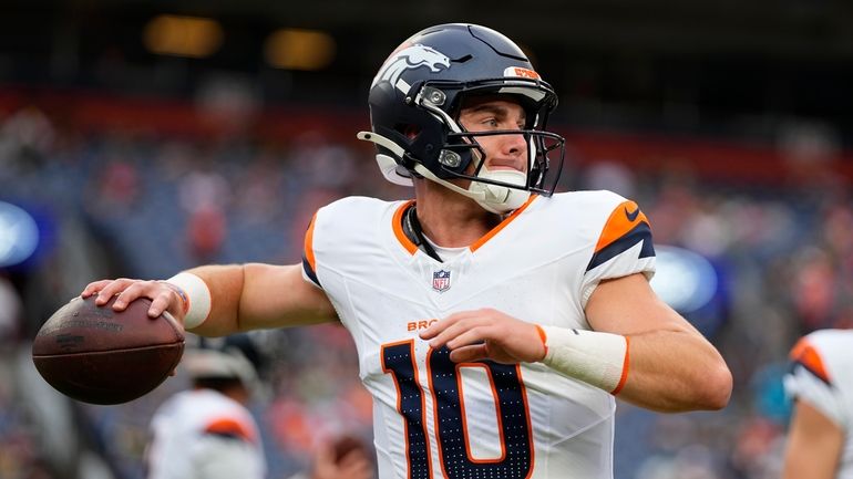 Denver Broncos quarterback Bo Nix warms up before a preseason...