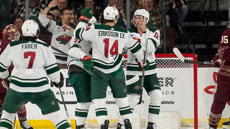 Minnesota Wild's Kirill Kaprizov, left, and Matt Boldy, right, celebrates...