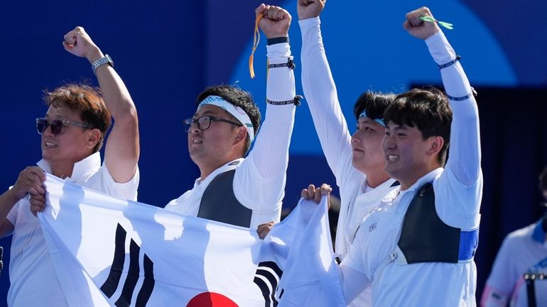 South Korea's Woojin Kim, center, Wooseok Lee, and Je Deok...