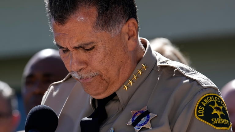 Los Angeles County Sheriff Robert Luna pauses while reading a...