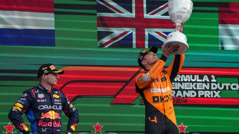 McLaren driver Lando Norris of Britain celebrates after winning the...