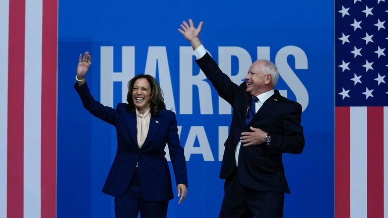 Democratic presidential nominee Vice President Kamala Harris and her running...