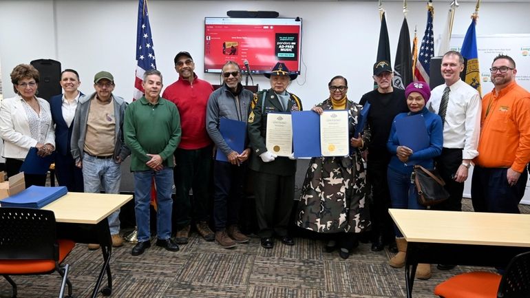 Vietnam veterans, members of SAGEVets, assembled at Long Island Cares’...